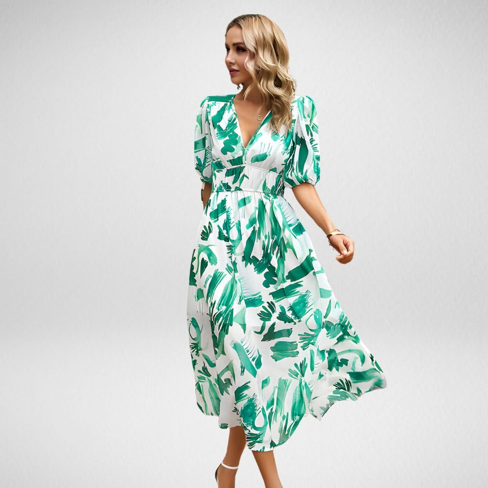 Elegantes Midikleid mit geformtem Ausschnitt und kurzen Ballonärmeln mit abstraktem Muster
