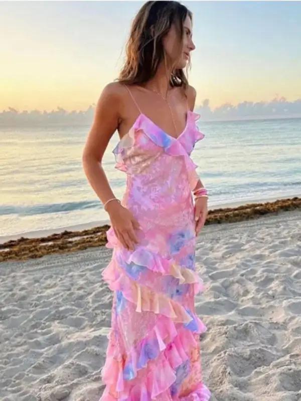 Langes Kleid mit tiefem Ausschnitt schmalen Trägern und verspieltem Volantabschluss